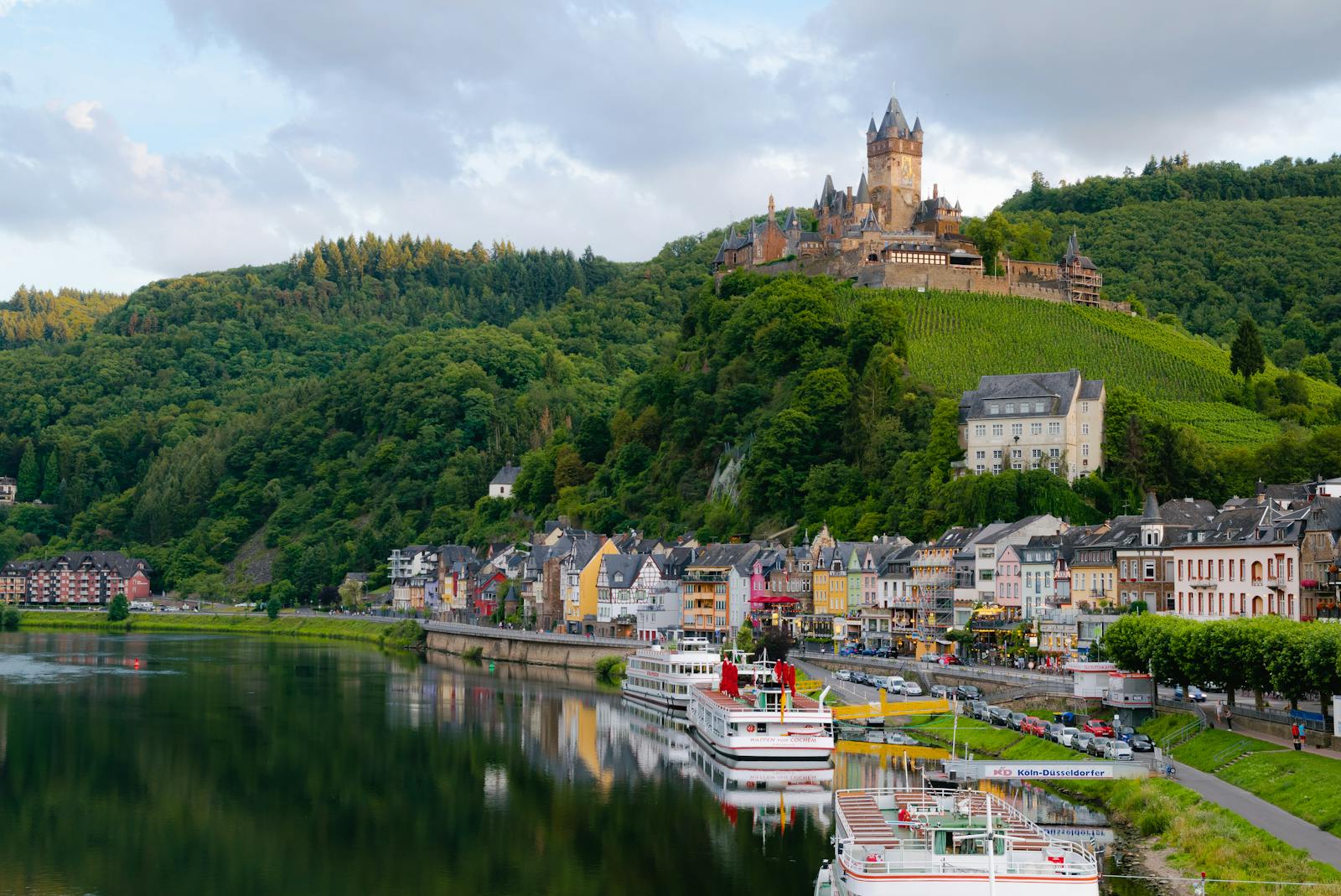 Idyllic landscape of Cochem Castle overlooking Moselle River in Germany.