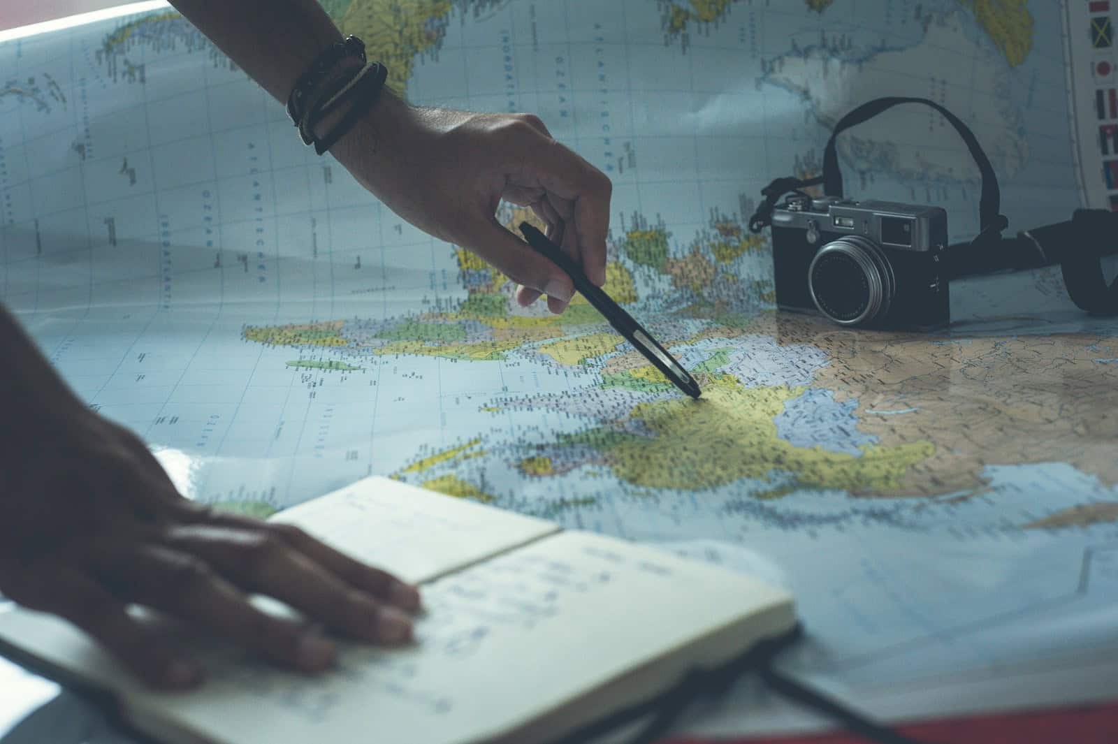Trip planning with map and notebook