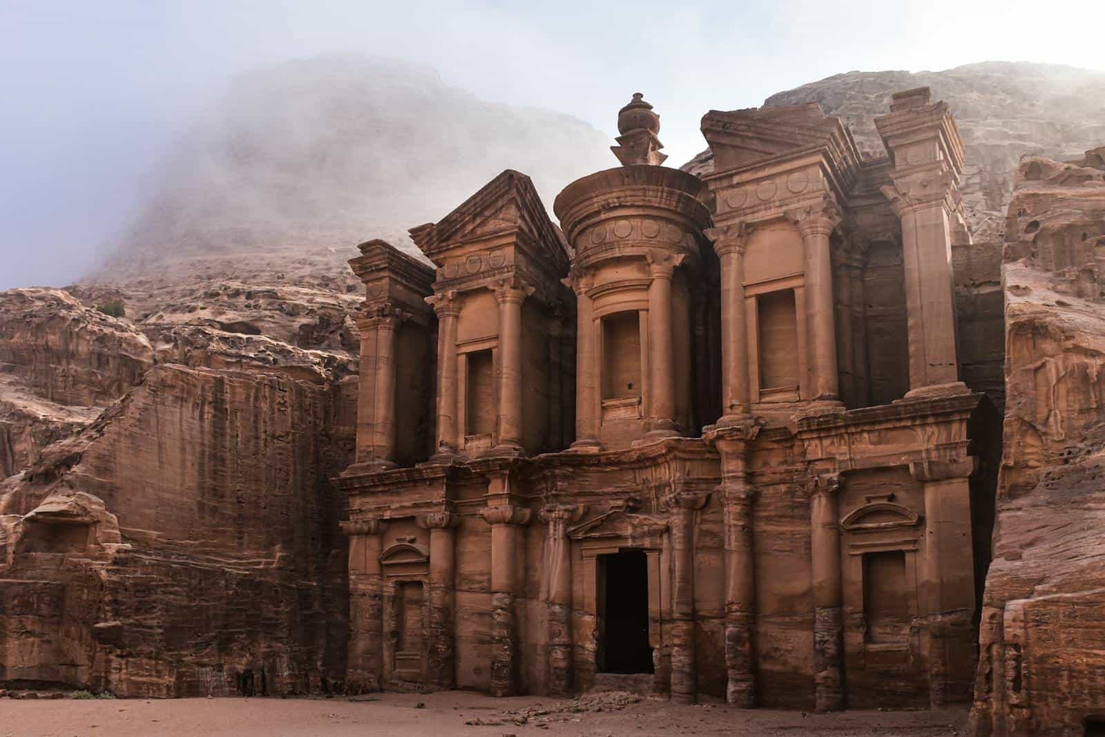 Must see wonders of the world-The Monastery in Petra, Jordan, revealing ancient architectural splendor amidst desert landscapes.