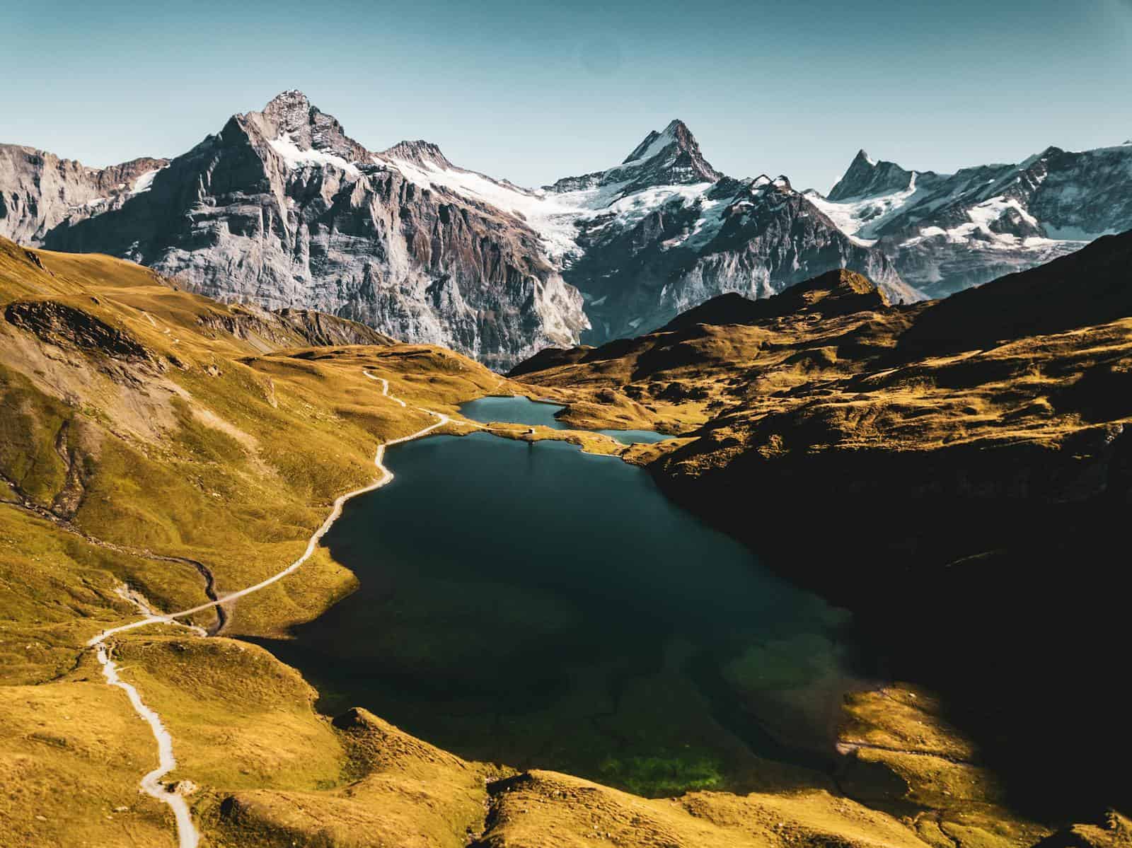 Breathtaking view of Bachalpsee with stunning alpine peaks in Grindelwald, Switzerland.