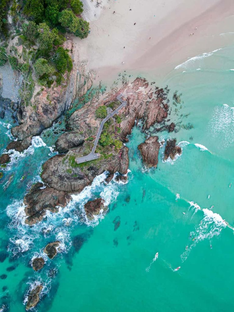 aerial view of green sea and brown mountain during daytime