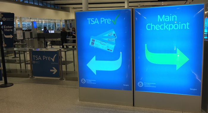 Airport travel hacks- TSA pre-check sign versus main checkpoint