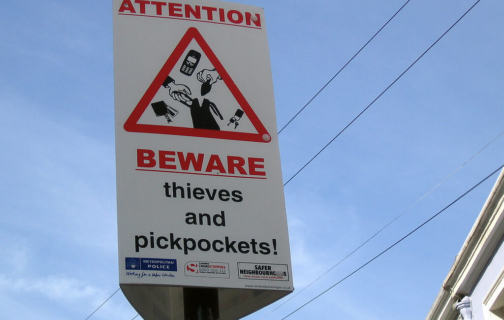 Travel safety tips for woman- beware sign