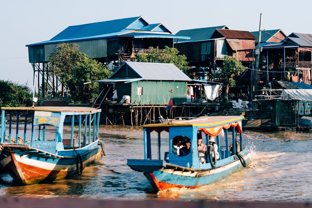 Colorful boats navigate near stilt houses in a vibrant riverside village.
Siem Reap itinerary